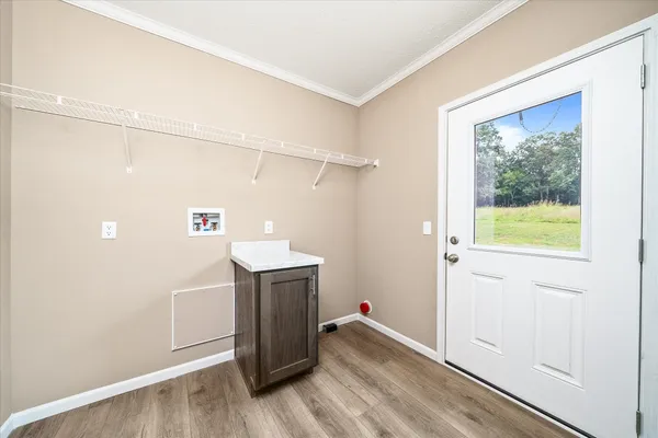a room with a door and wooden floor