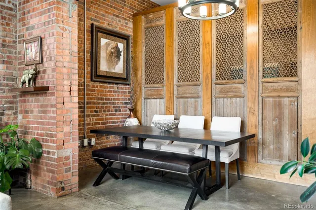 a outdoor living room with furniture and a potted plant