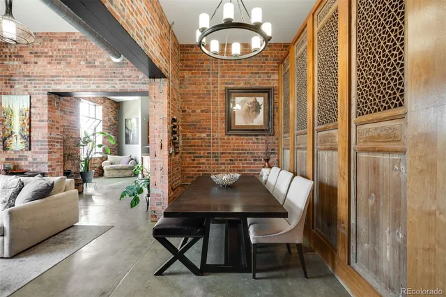 a dining room with furniture and wooden floor