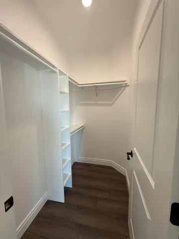a view of an empty walk in closet