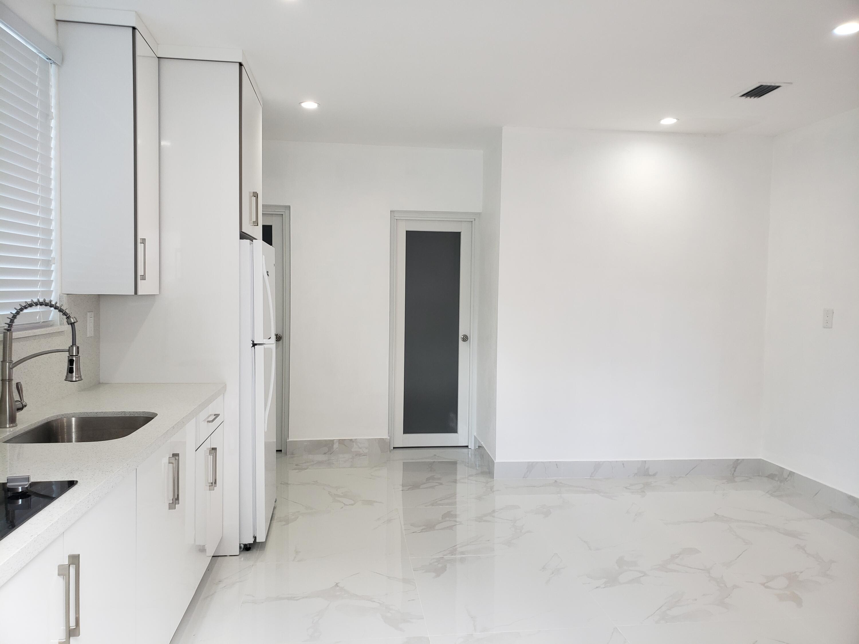 a bathroom with a sink and a shower