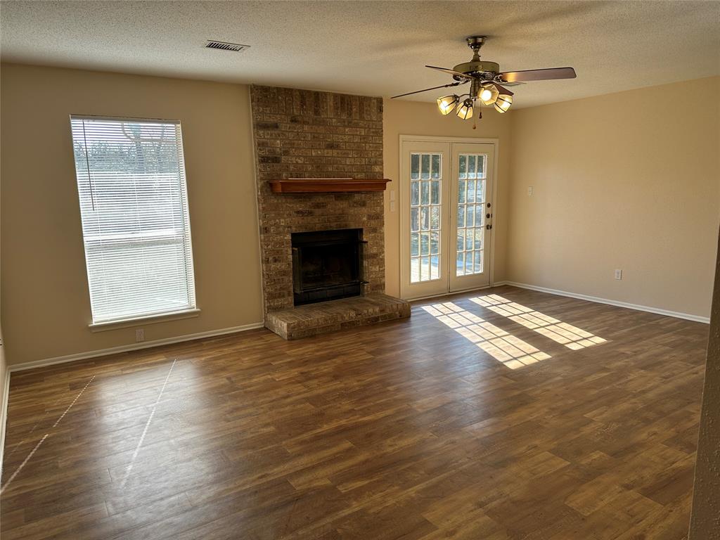 1047 Pr 3022 Elgin Elgin, TX 78621 - Photo 6 of 21 Large windows bring the outdoors in, filling the home with natural light and wooded views throughout.