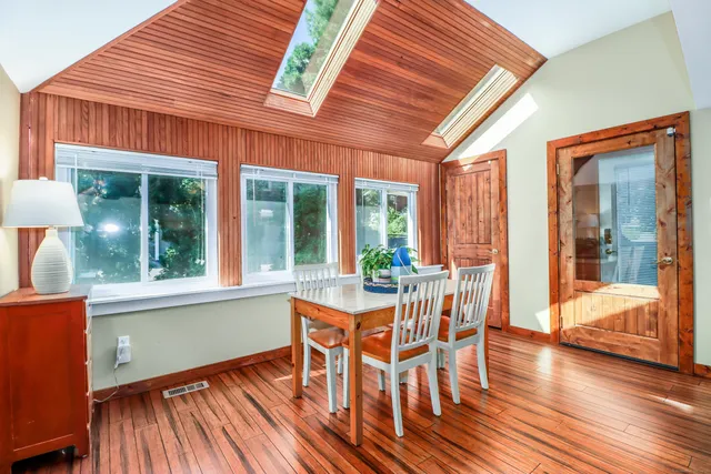 a view of a dining room with furniture window and wooden floor