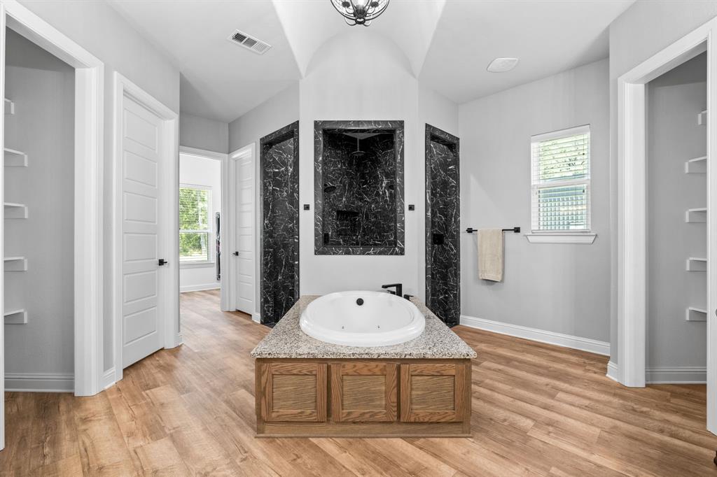 6707 Anchor Quinlan, TX 75474 - Photo 21 of 40 Dreamy walk-in shower with huge soaking tub.
