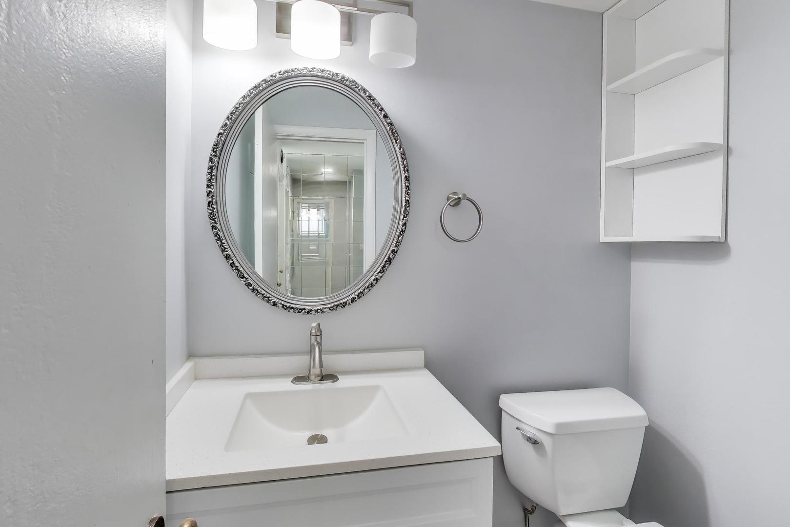 637 Bridgeview Point Schaumburg, IL 60194 - Photo 12 of 28 a bathroom with a toilet sink and mirror