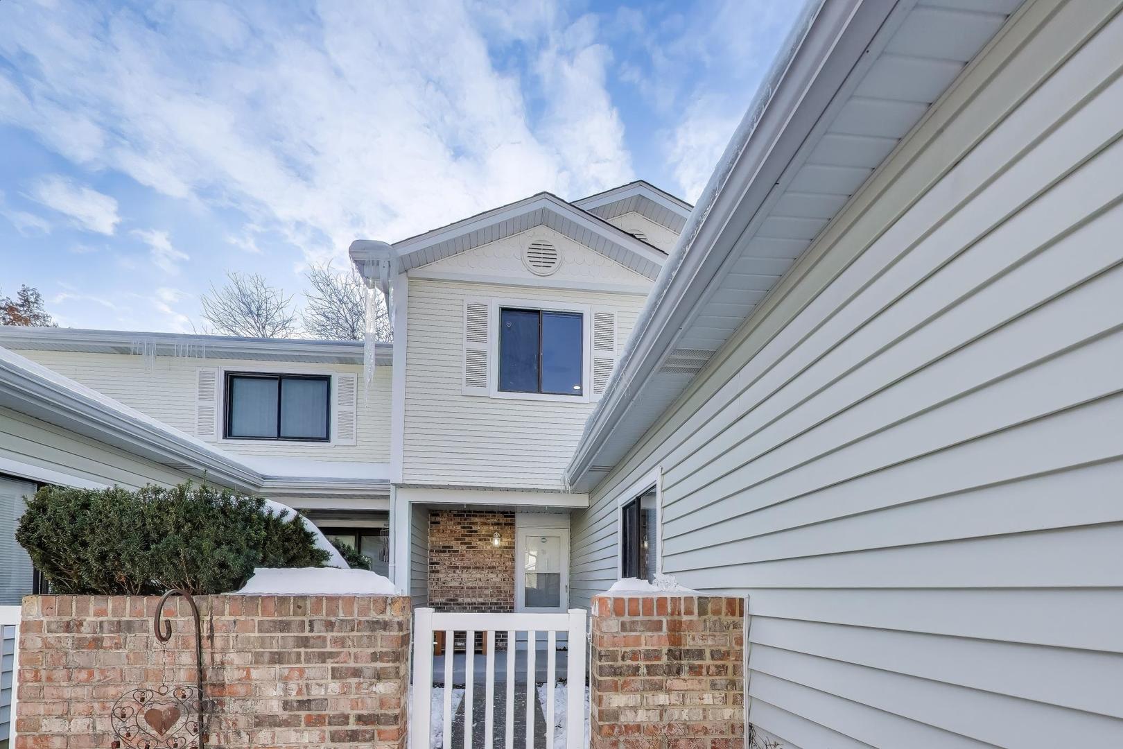 637 Bridgeview Point Schaumburg, IL 60194 - Photo 2 of 28 a front view of a house with plants