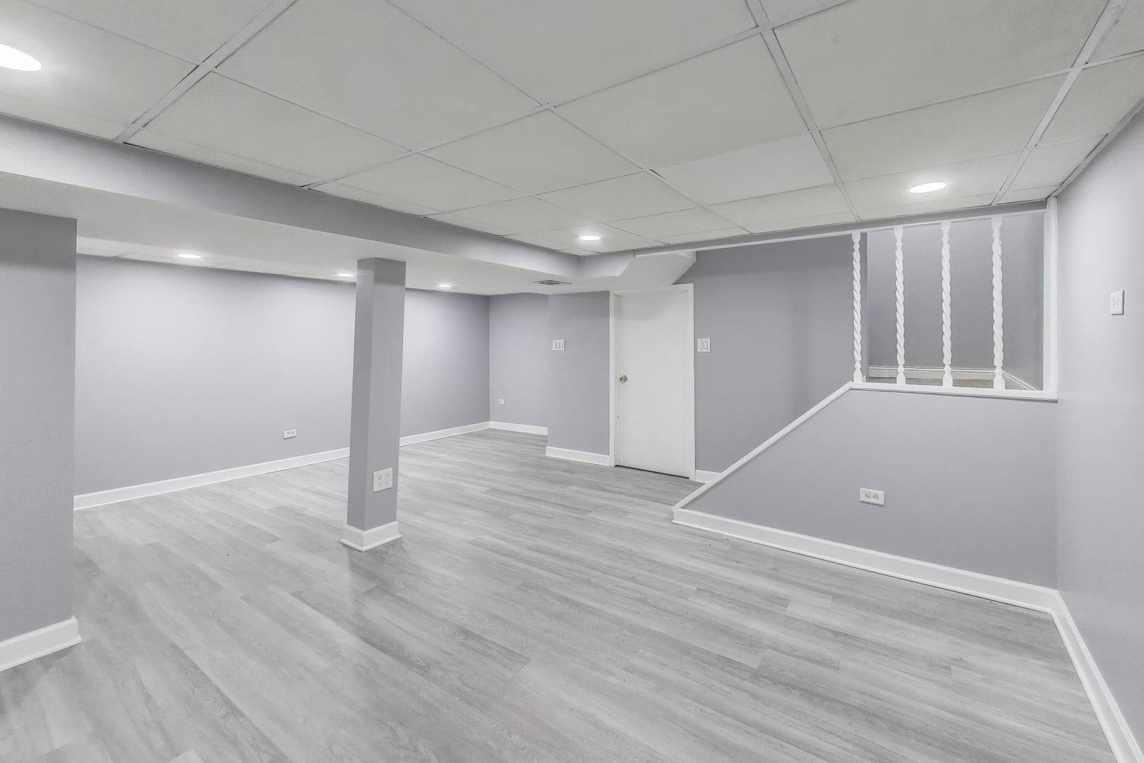 637 Bridgeview Point Schaumburg, IL 60194 - Photo 23 of 28 a view of an empty room with wooden floor and a window