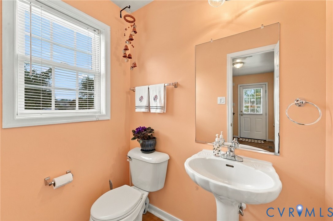 244 East Huntsman Road Sandston, VA 23150 - Photo 32 of 54 Pedestal sink with chrome faucet, wall-mounted mir