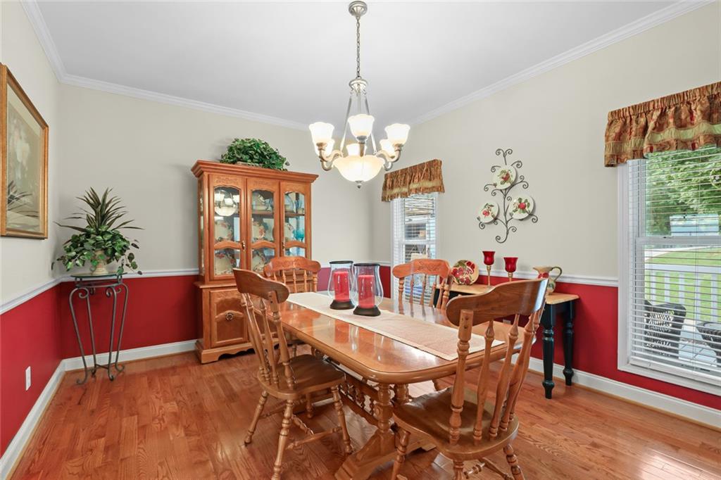 1168 Highland Road Sautee Nacoochee, GA 30571 - Photo 22 of 65 a view of a dining room with furniture window and wooden floor