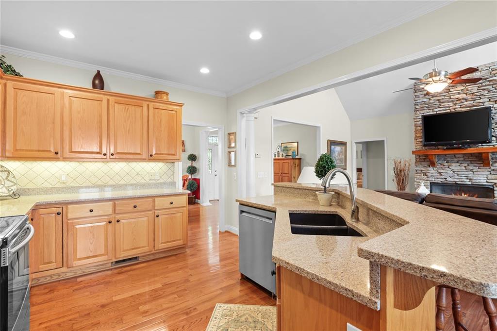 1168 Highland Road Sautee Nacoochee, GA 30571 - Photo 24 of 65 a kitchen with granite countertop a sink and a stove top oven