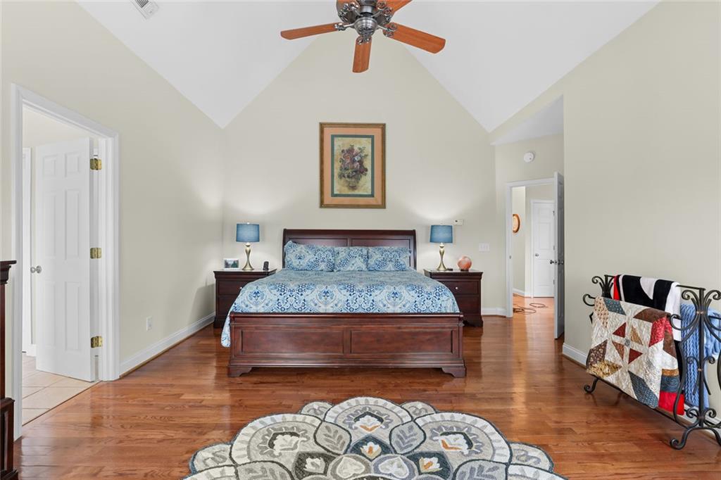 1168 Highland Road Sautee Nacoochee, GA 30571 - Photo 26 of 65 a bedroom with a bed and wooden floor