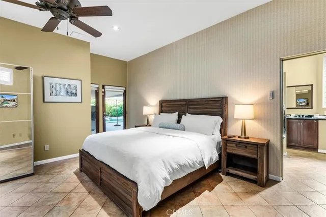 a view of a house with sitting area and garden