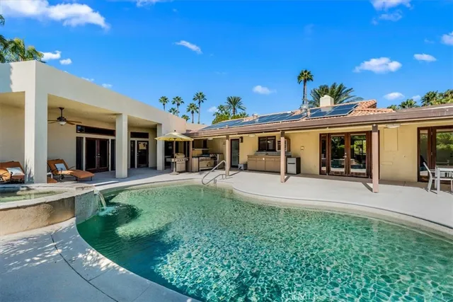 a building outdoor space with patio furniture and potted plants