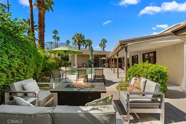 a view of a terrace with furniture
