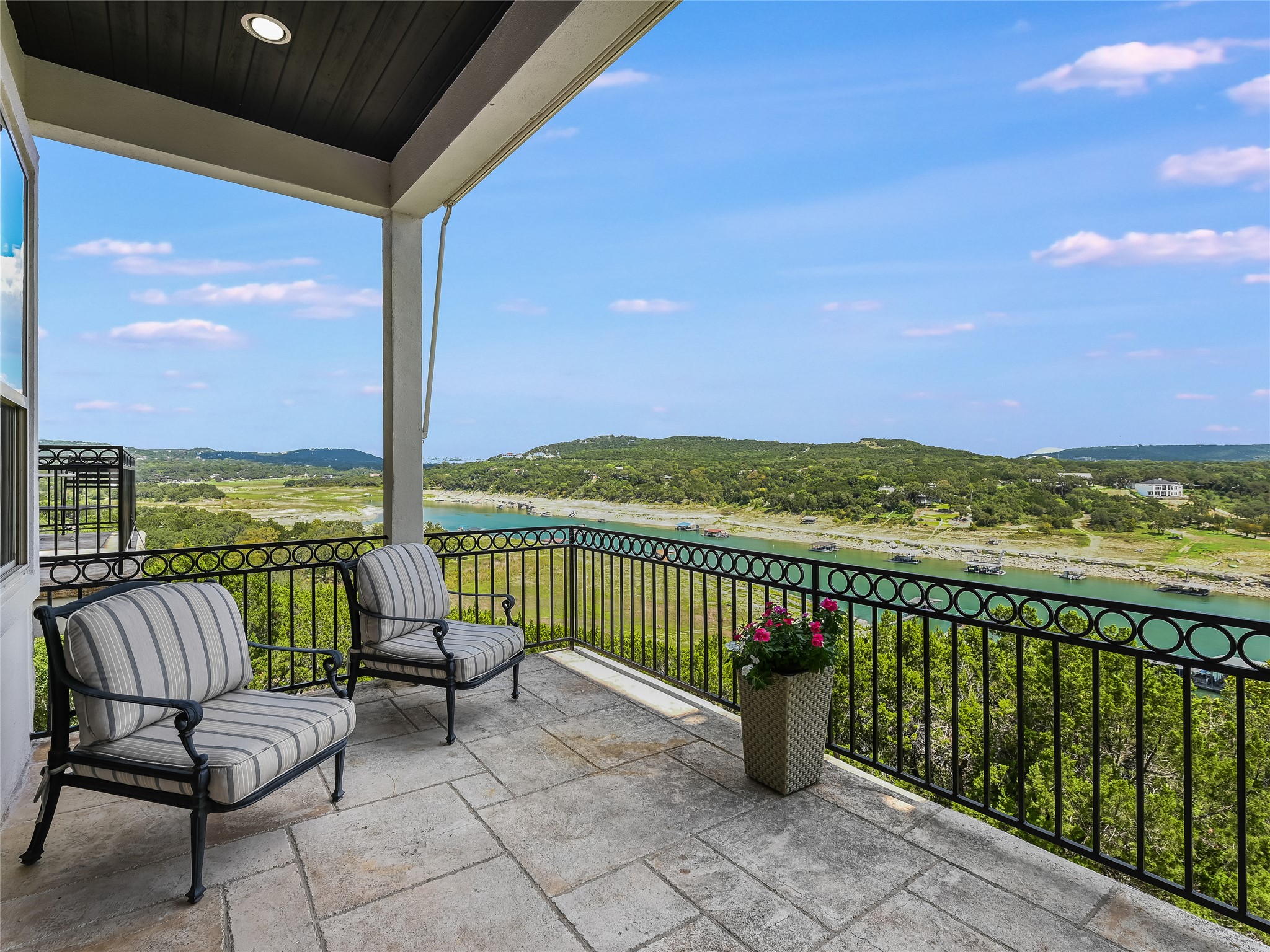 17545 West Reed Park Road, Unit 5 Jonestown, TX 78645 - Photo 9 of 26 a view of a chairs and table in the balcony