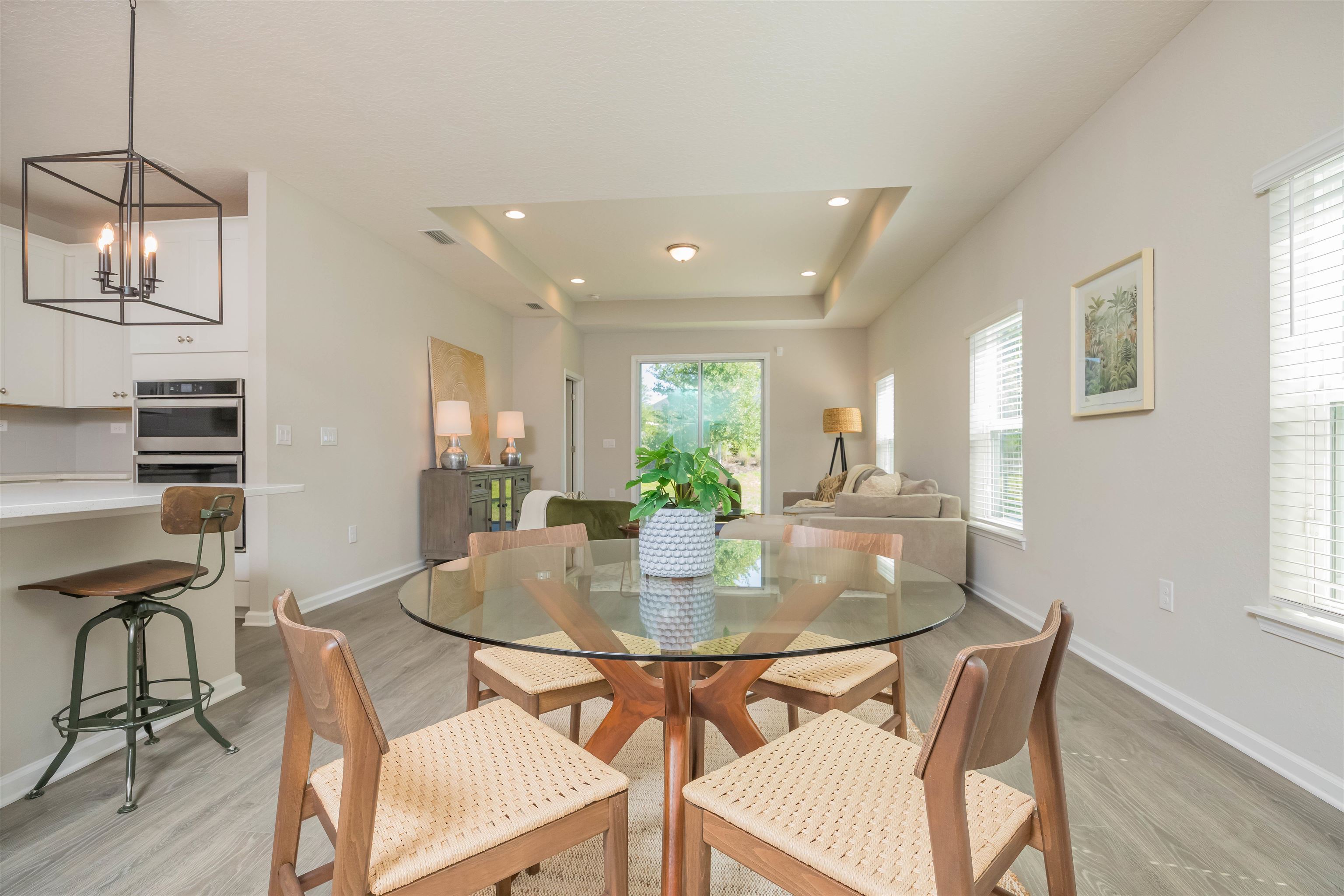 98 Windermere Way St. Augustine, FL 32095 - Photo 11 of 76 a view of a dining room with furniture and wooden floor