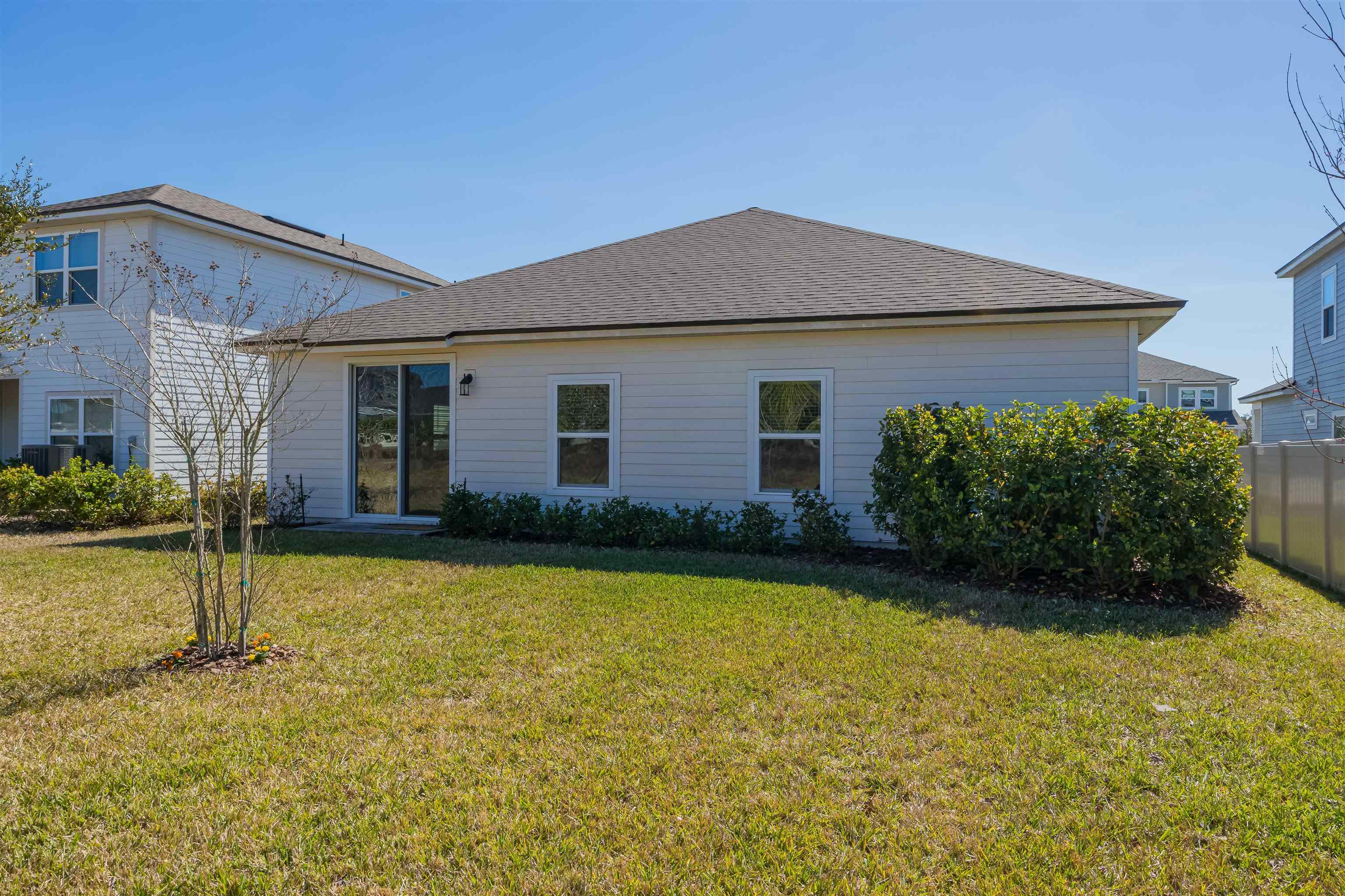 98 Windermere Way St. Augustine, FL 32095 - Photo 48 of 76 front view of a house with a yard