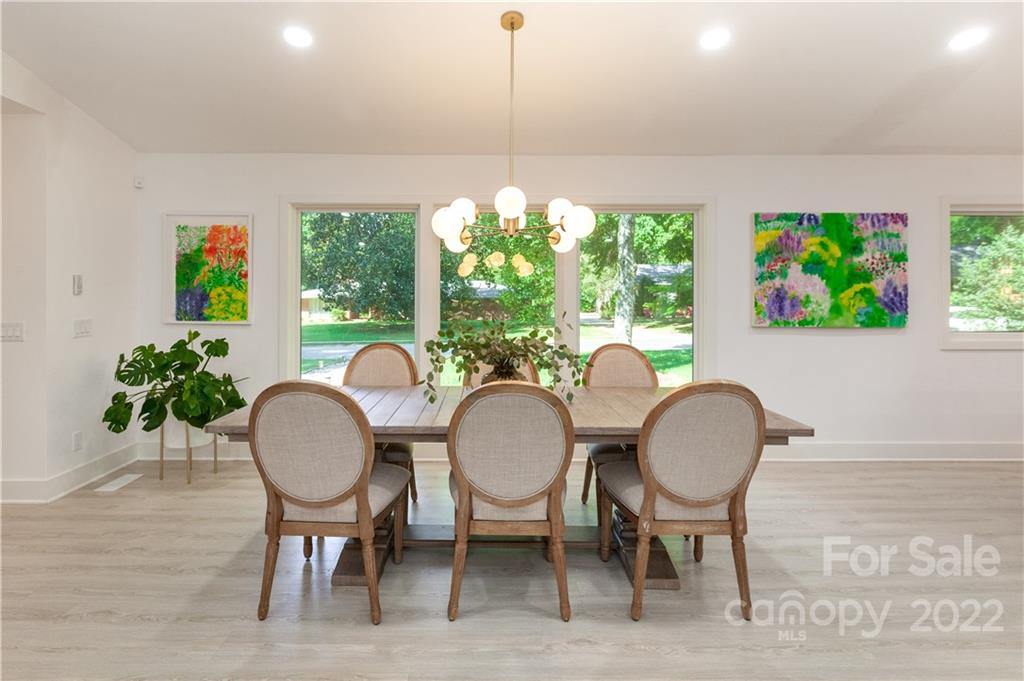 621 Wingrave Drive Charlotte, NC 28270 - Photo 12 of 48 a dining room with furniture a potted plant and windows