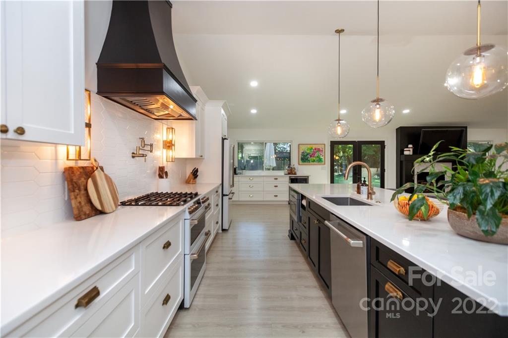 621 Wingrave Drive Charlotte, NC 28270 - Photo 18 of 48 a large kitchen with lots of counter space and wooden floor