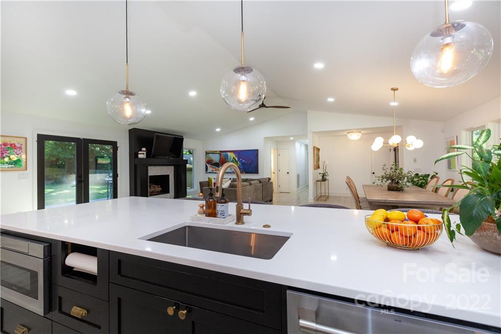 621 Wingrave Drive Charlotte, NC 28270 - Photo 23 of 48 a view of a room with kitchen island stainless steel appliances sink and living room view