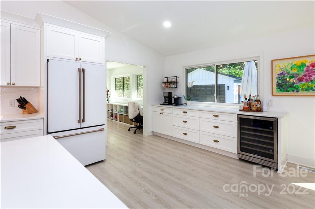 621 Wingrave Drive Charlotte, NC 28270 - Photo 24 of 48 a kitchen with furniture a window and a refrigerator
