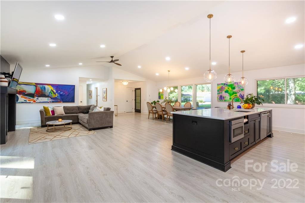 621 Wingrave Drive Charlotte, NC 28270 - Photo 25 of 48 a living room with furniture kitchen and a wooden floor