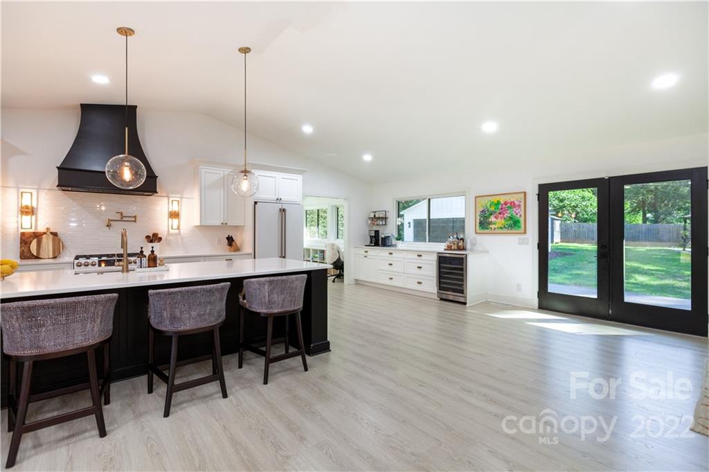 621 Wingrave Drive Charlotte, NC 28270 - Photo 26 of 48 a kitchen with stainless steel appliances granite countertop a sink a stove and a wooden floors
