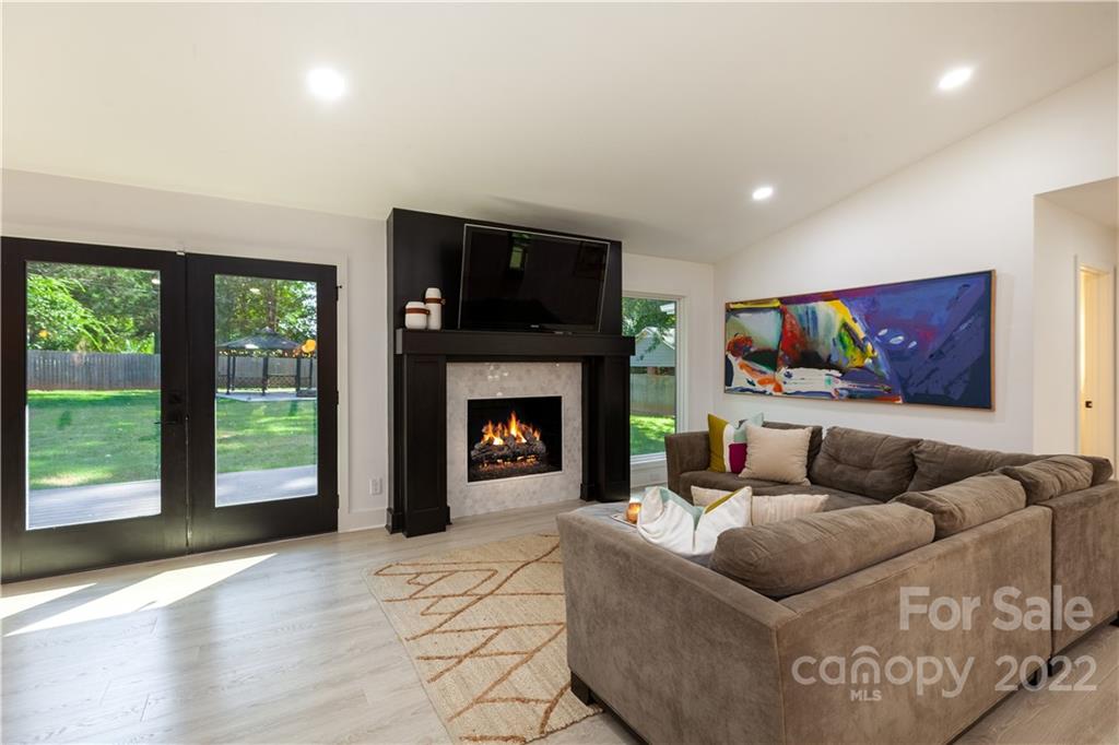 621 Wingrave Drive Charlotte, NC 28270 - Photo 27 of 48 a living room with furniture and a fireplace