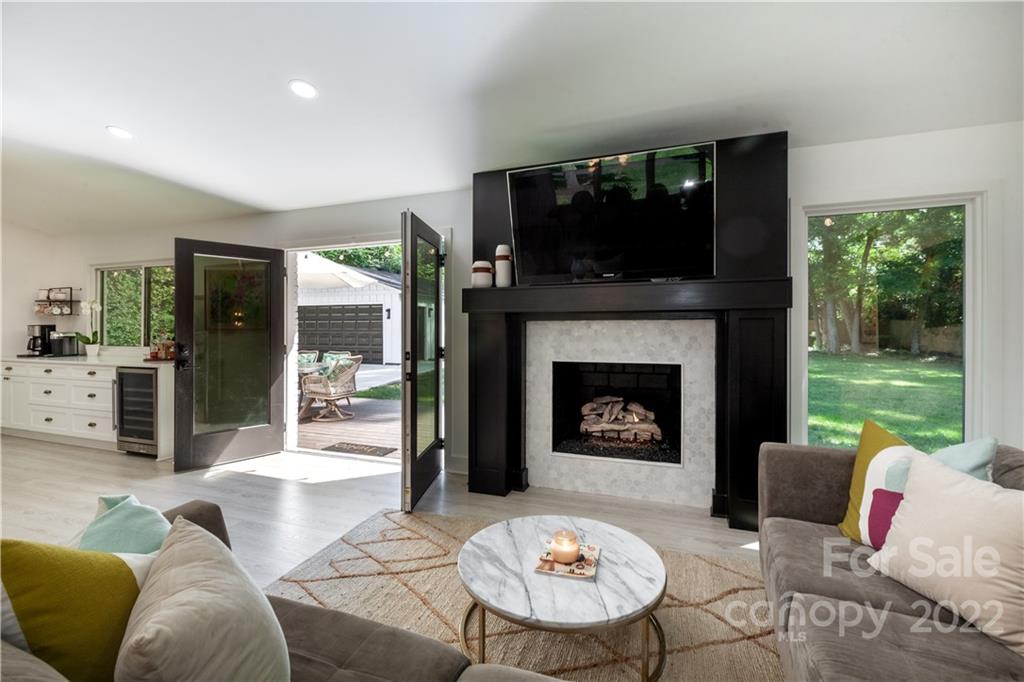 621 Wingrave Drive Charlotte, NC 28270 - Photo 28 of 48 a living room with furniture fireplace and a flat screen tv