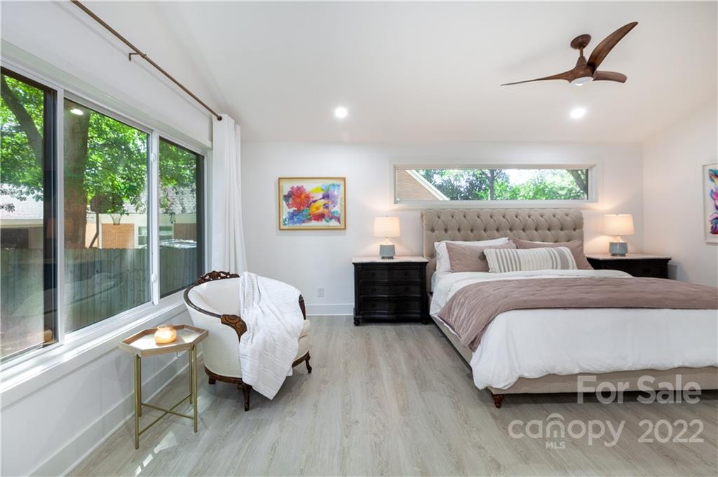 621 Wingrave Drive Charlotte, NC 28270 - Photo 32 of 48 a bedroom with a bed and a large window