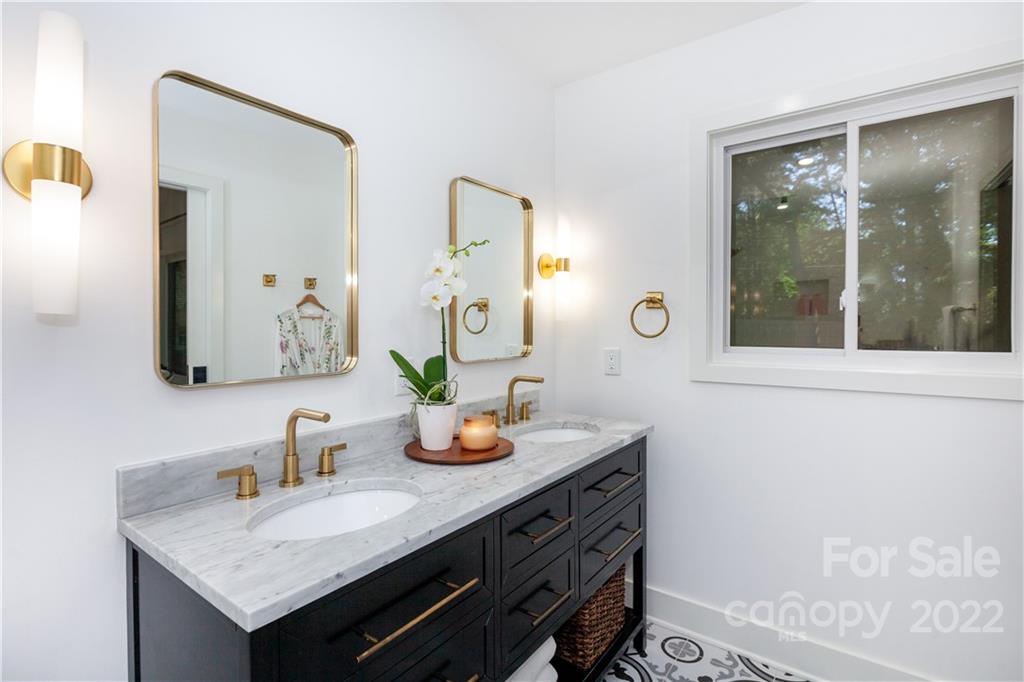 621 Wingrave Drive Charlotte, NC 28270 - Photo 36 of 48 a bathroom with a granite countertop sink and a mirror