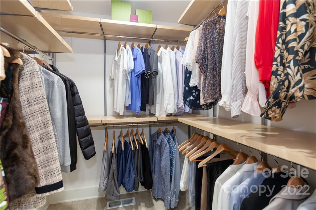 621 Wingrave Drive Charlotte, NC 28270 - Photo 37 of 48 a view of walk in closet with clothes and shoes