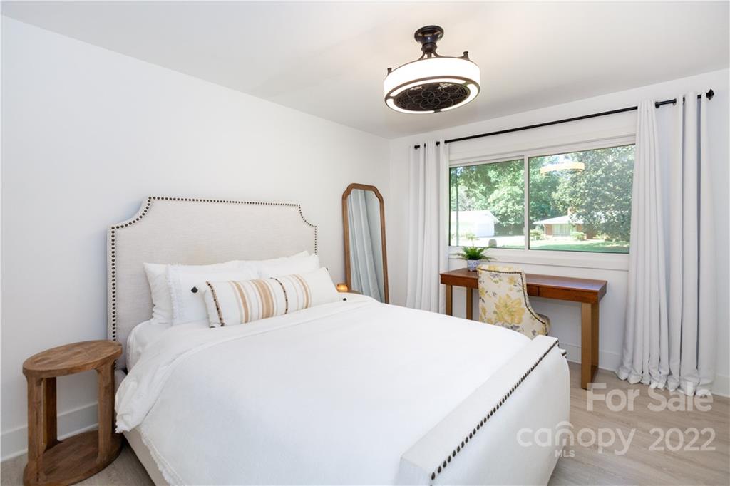 621 Wingrave Drive Charlotte, NC 28270 - Photo 38 of 48 a bedroom with a large bed and a large window