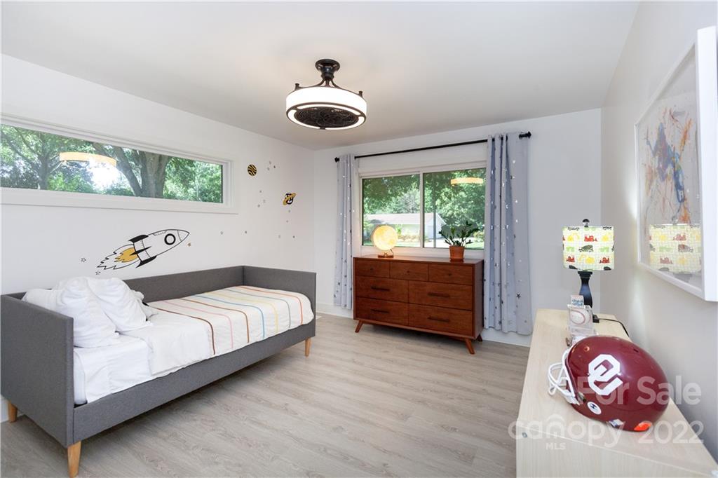 621 Wingrave Drive Charlotte, NC 28270 - Photo 39 of 48 a bedroom with a bed and a large window