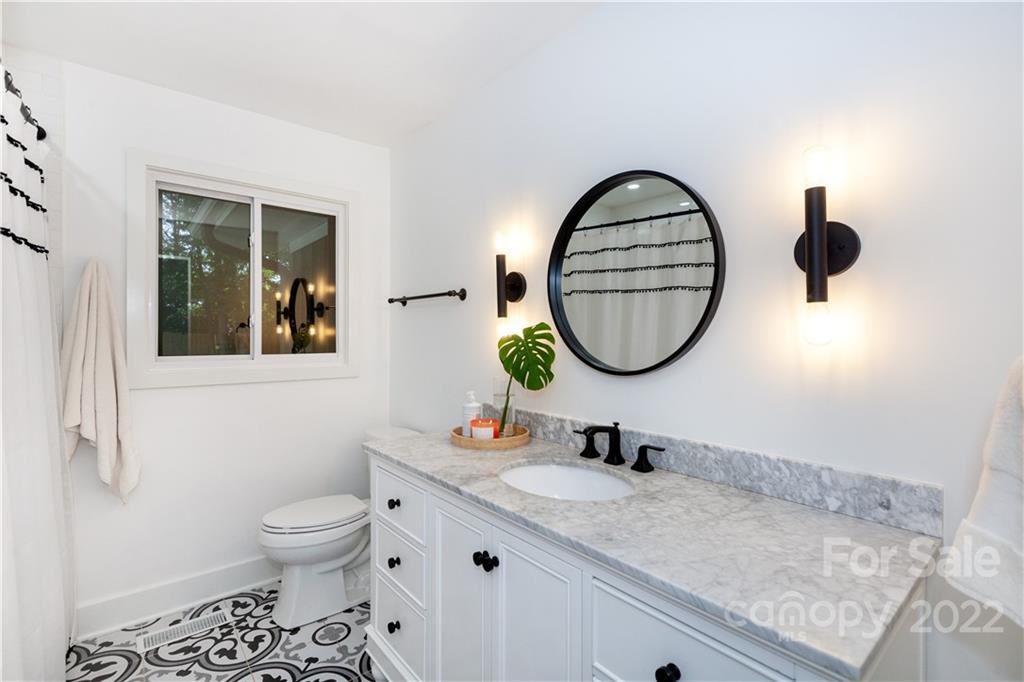 621 Wingrave Drive Charlotte, NC 28270 - Photo 40 of 48 a bathroom with a sink and a mirror