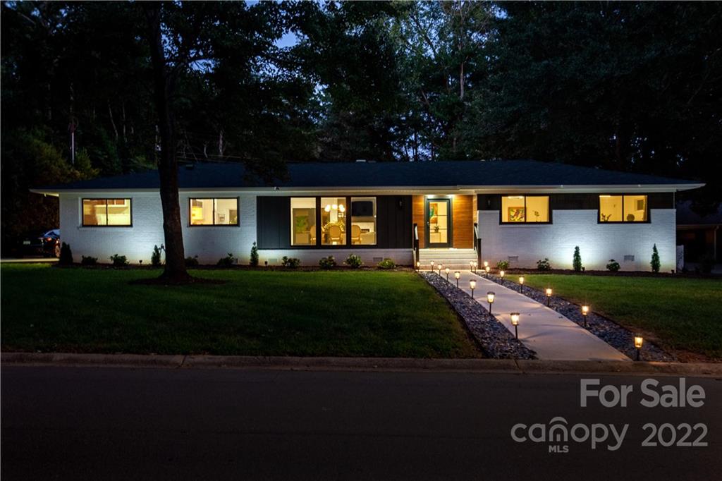 621 Wingrave Drive Charlotte, NC 28270 - Photo 4 of 48 a swimming pool with a yard in back