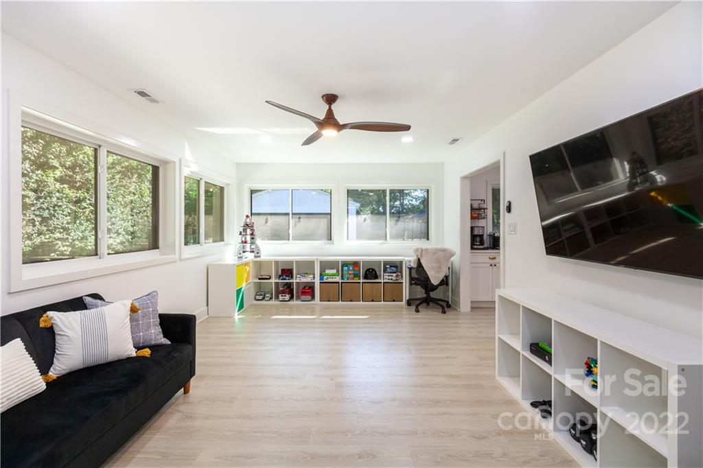 621 Wingrave Drive Charlotte, NC 28270 - Photo 43 of 48 a living room with furniture and a flat screen tv