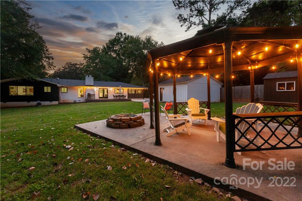 621 Wingrave Drive Charlotte, NC 28270 - Photo 6 of 48 a view of a house with backyard porch and sitting area