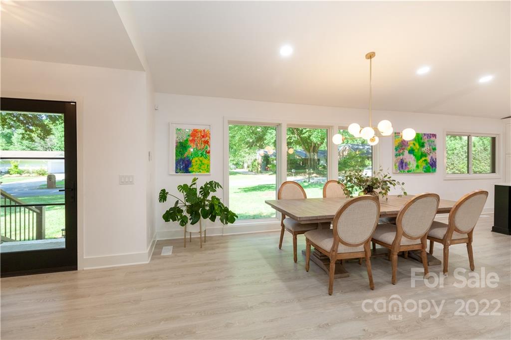 621 Wingrave Drive Charlotte, NC 28270 - Photo 10 of 48 a view of a dining room with furniture window and wooden floor