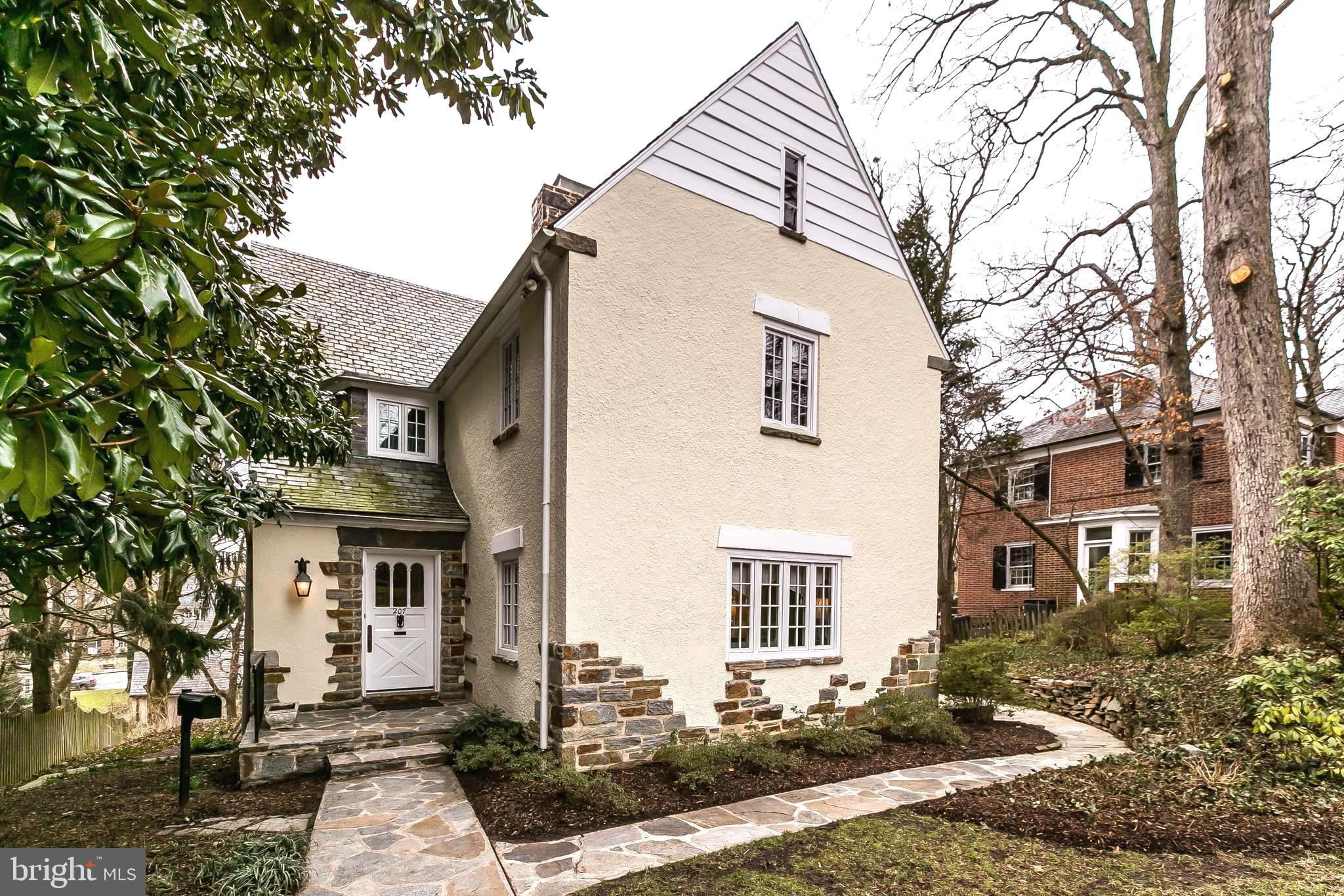 This tudor house is stone and stucco.