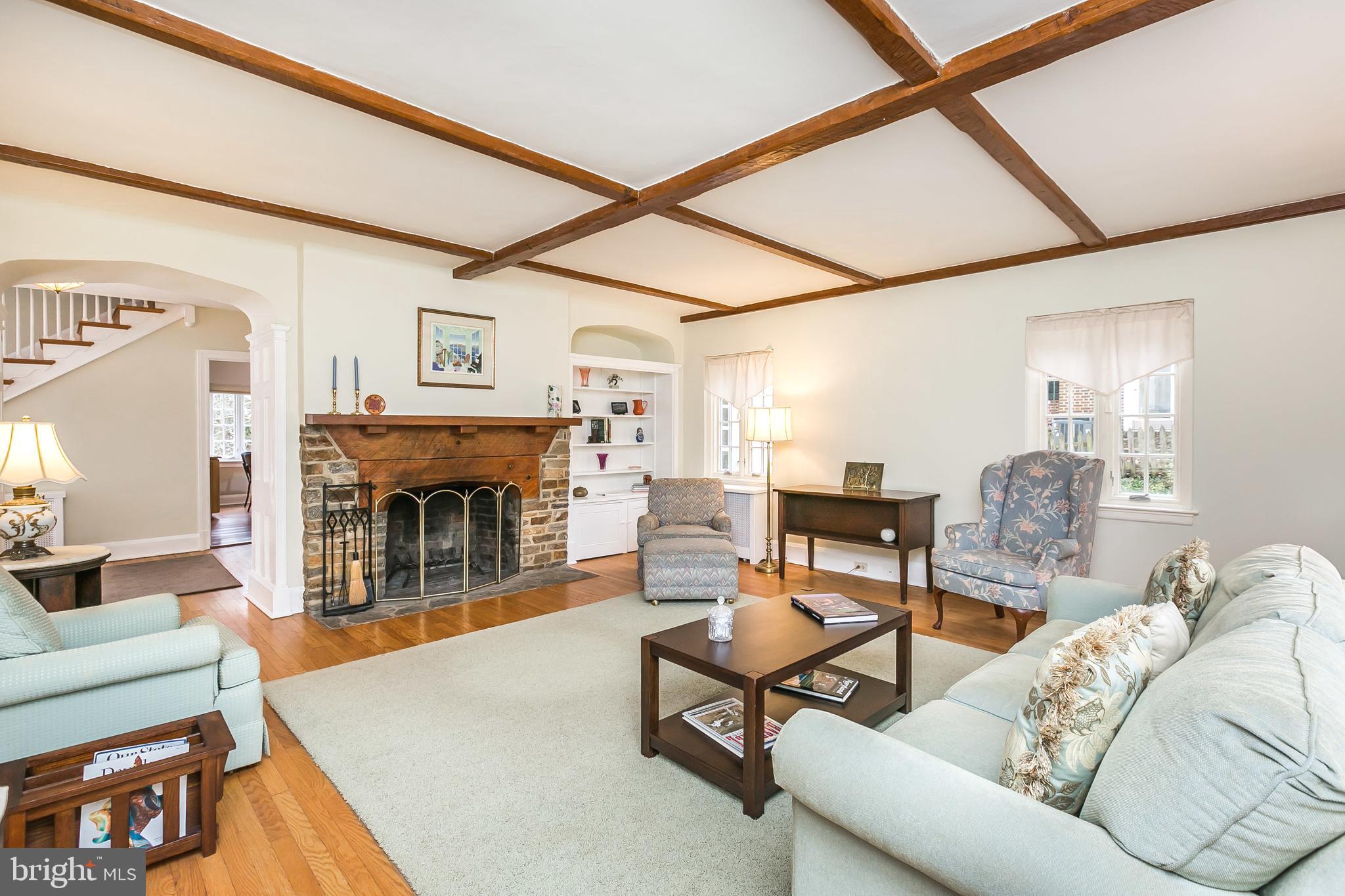 207 Tunbridge Road Baltimore, MD 21212 - Photo 6 of 43 The living room is equipped with a stone fireplace