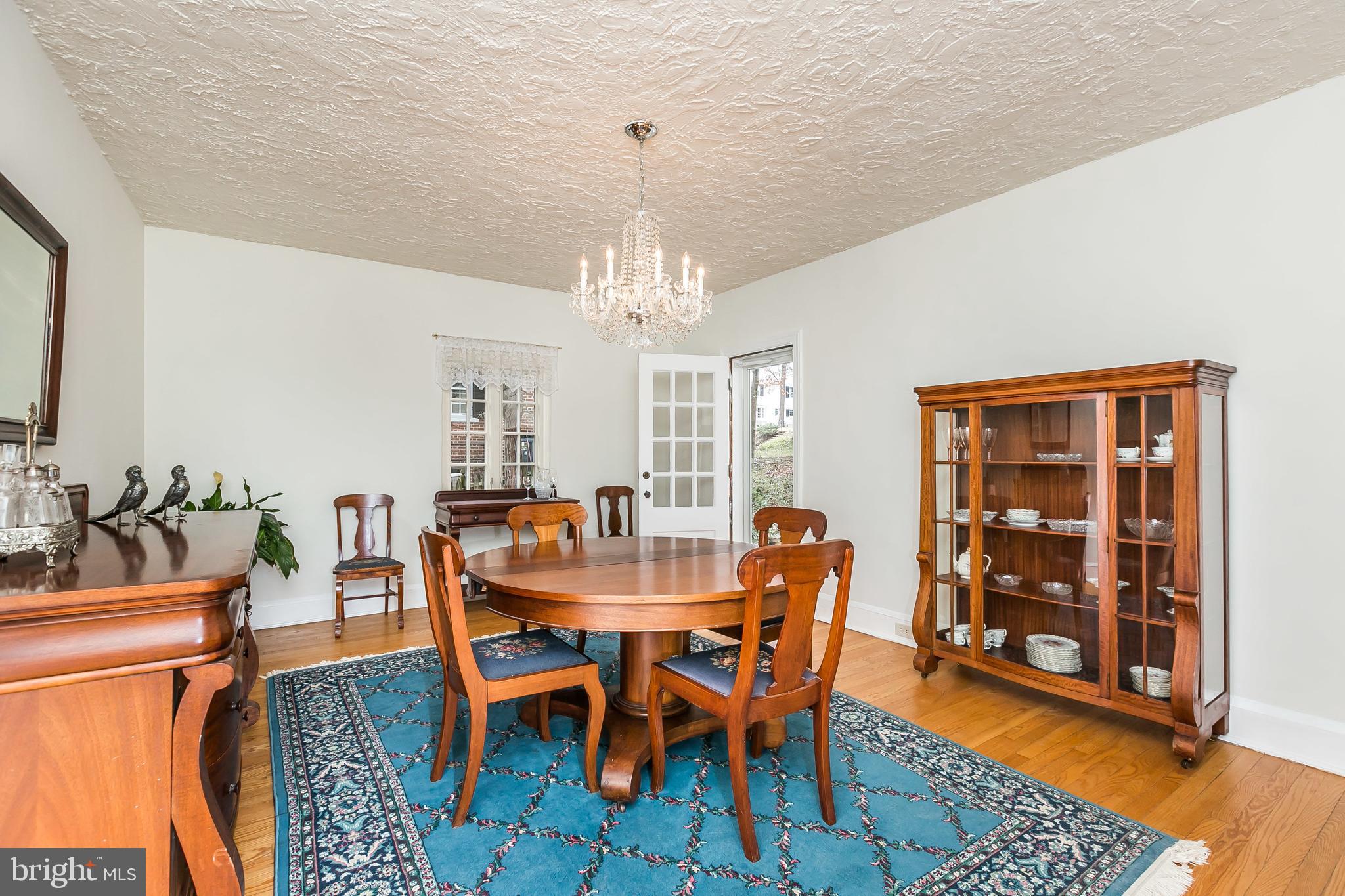 207 Tunbridge Road Baltimore, MD 21212 - Photo 10 of 43 The dining room has a lovely chandelier.