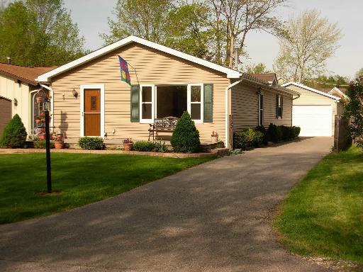 23630 North East Road Lake Zurich, IL 60047 - Photo 1 of 1 a front view of a house with a yard and chairs