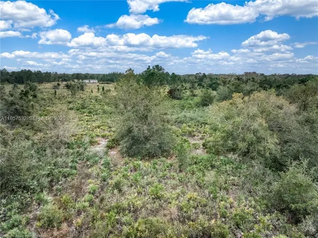 a view of a field with an outdoor space