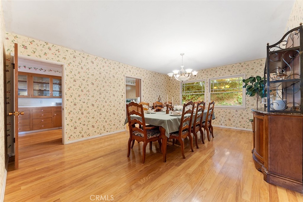 1940 Arroyo Drive Riverside, CA 92506 - Photo 14 of 50 Very roomy formal dining room with two points of access to the kitchen and a throughway to the den and throughway to the entyr/living.