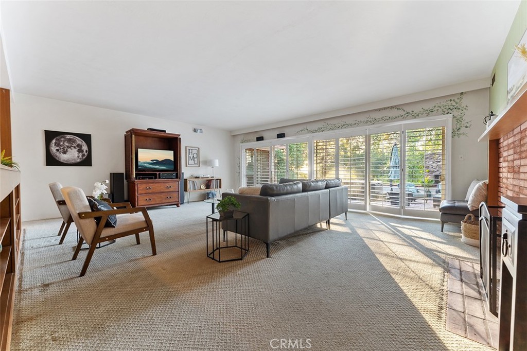 1940 Arroyo Drive Riverside, CA 92506 - Photo 19 of 50 Spacious formal living room with sliders to the backyard and a functioning fireplace.