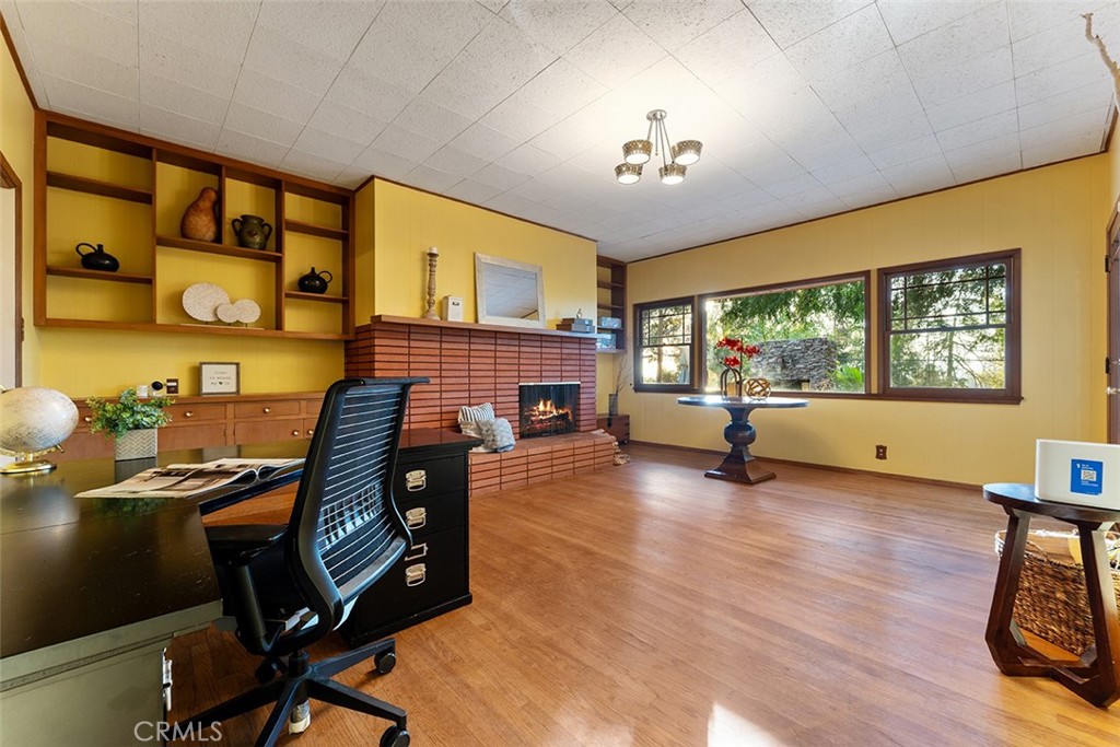 1940 Arroyo Drive Riverside, CA 92506 - Photo 8 of 50 Den with built ins. View of backyard. Fire is photoshopped.