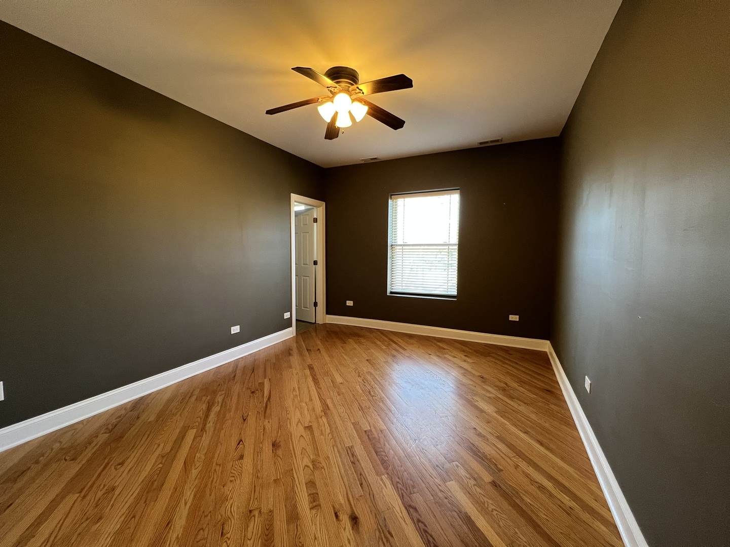 911 Maple Avenue, Unit 3N Evanston, IL 60202 - Photo 9 of 18 wooden floor in an empty room with a window