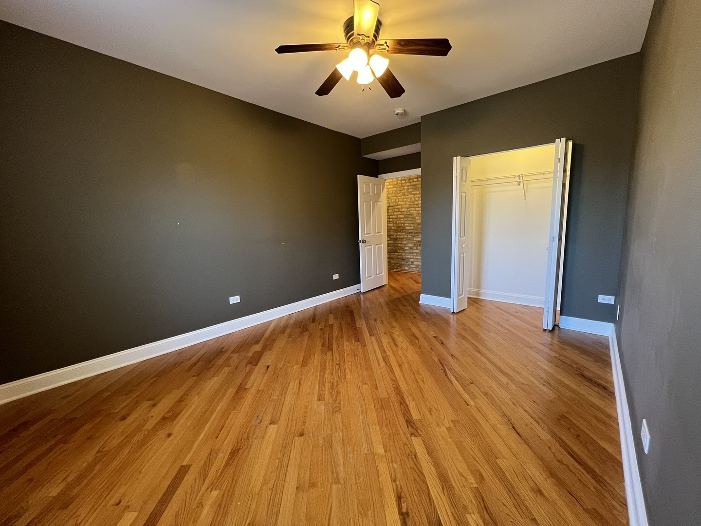 911 Maple Avenue, Unit 3N Evanston, IL 60202 - Photo 10 of 18 a view of empty room with wooden floor