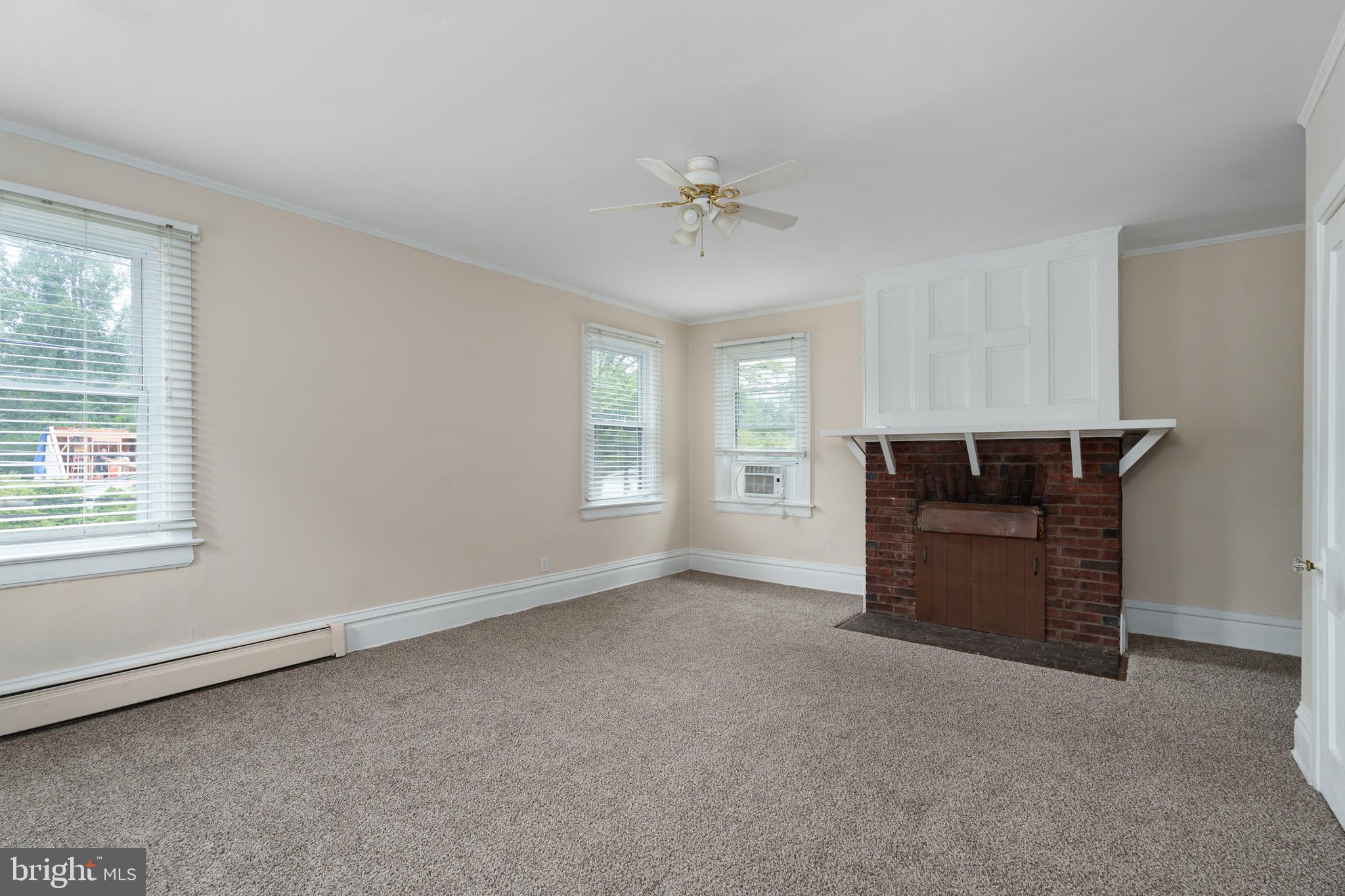 124 Washington Road, Unit 2 Princeton, NJ 08540 - Photo 12 of 13 a view of a livingroom with a dishwasher and a window